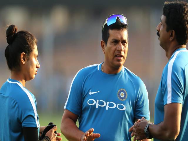 Tushar Arothe with Mithali Raj and other coaching staff.