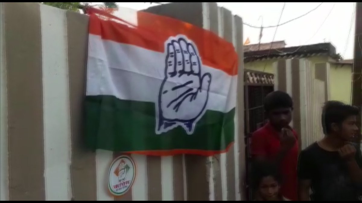 Congress symbol is seen outside a polling booth in Katihar