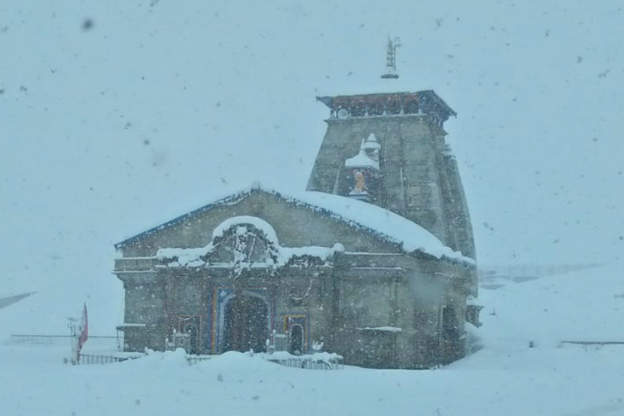 administration and temple committee removing snow from Kedarnath temple