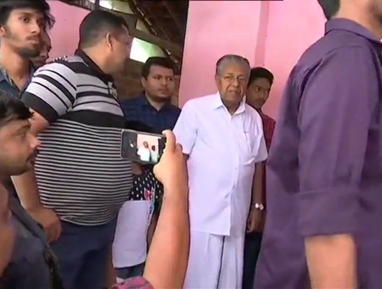 CM P. Vijayan queues up to casts his vote