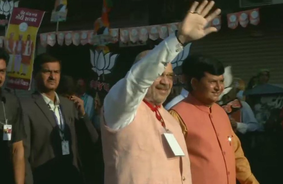 BJP President Amit Shah near the polling booth at Nishan Higher Secondary School in Ranip