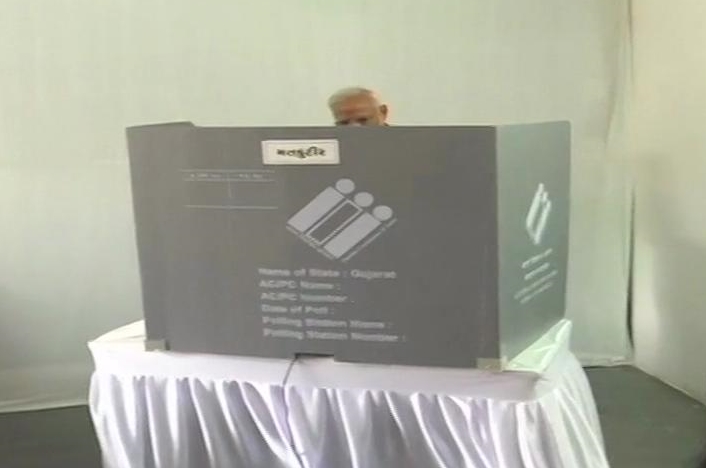 PM Narendra Modi casts his vote at a polling booth in Ranip,Ahmedabad