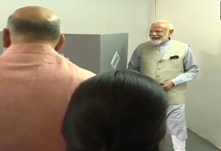 PM Narendra Modi casts his vote at a polling booth in Ranip,Ahmedabad