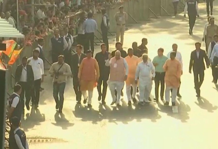 BJP President Amit Shah near the polling booth at Nishan Higher Secondary School in Ranip