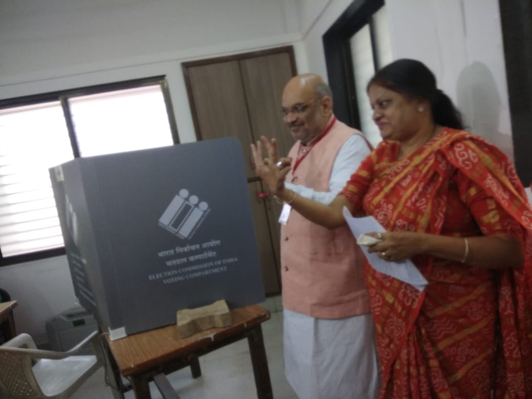 BJP President Amit Shah and his wife Sonal Shah cast their votes