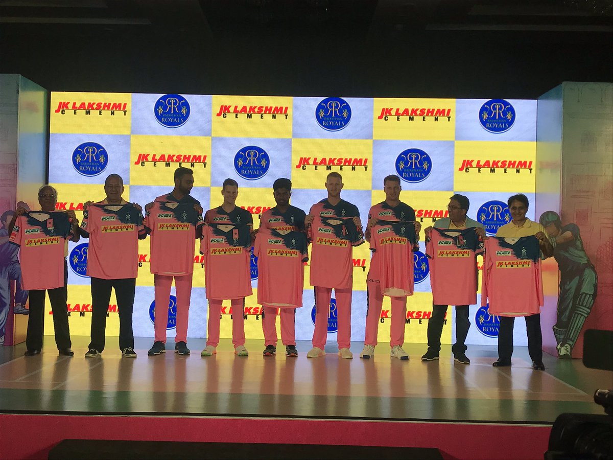 Rajasthan Royals players pose with the pink jersey