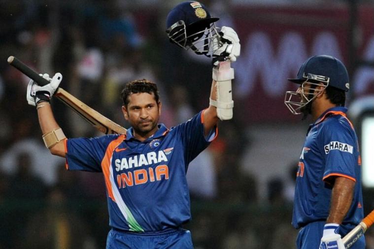 Tendulkar raises his bat after slamming double ton in ODIs against SA in 2010.