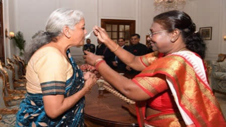 President Draupadi Murmu feeding payasam to Finance Minister Nirmala Sitharaman