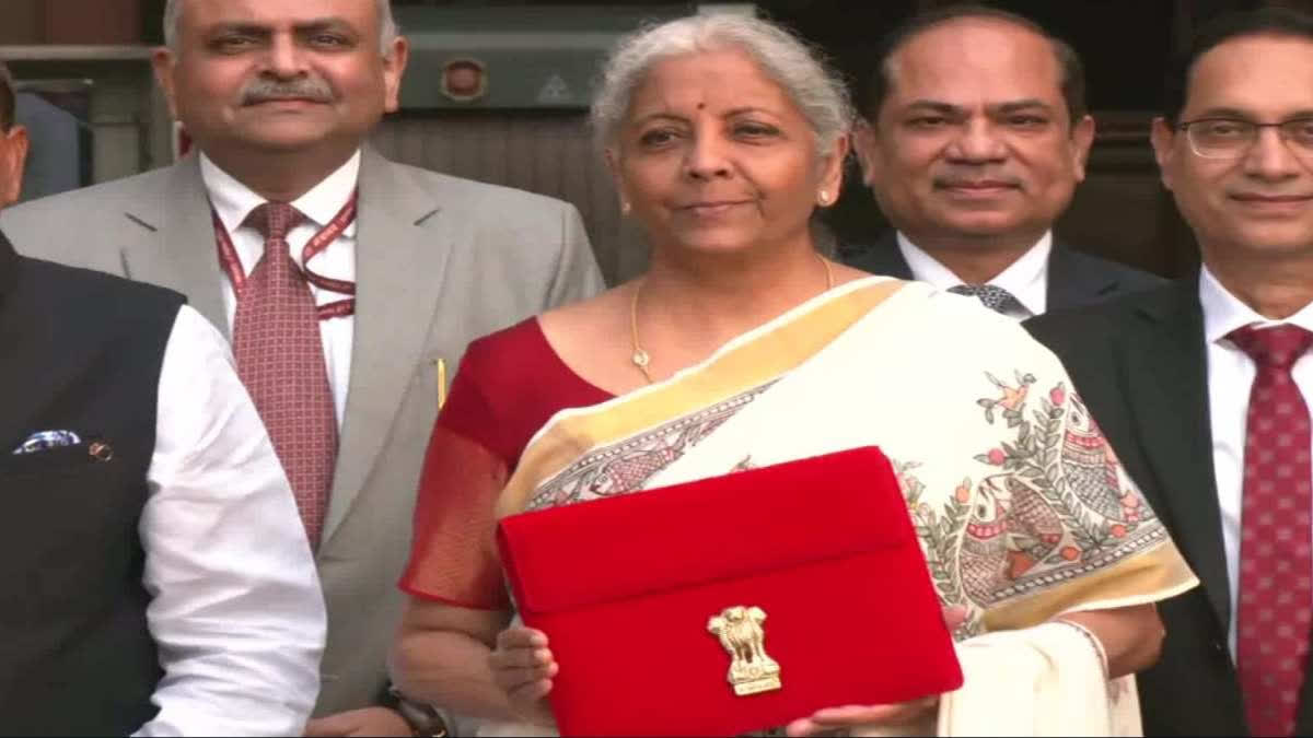 sitharaman-takes-tablet-in-red-pouch-to-present-paperless-budget