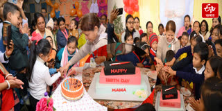 Minister Ajanta Neog cuts CM's birthday cake with students in Golaghat