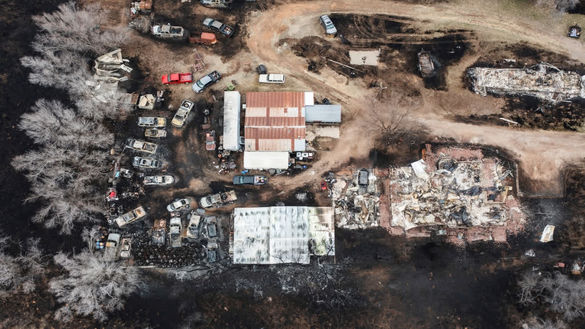 Multiple vehicles and residences are seen destroyed by the Smokehouse Creek Fire in Texas. (AP)
