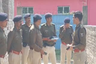 Cops examining the spot where six live bombs were recovered in Darbhanga