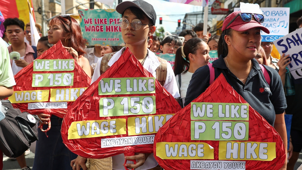 Filipino workers carry streamers and posters during a protest to mark International Labor Day near the presidential palace in Manila, Philippines on Wednesday, May 1, 2024. Hundreds of Filipino workers from various labor groups took to the streets to mark Labor Day and demand a wage increase and job security amid soaring food and oil prices. (AP Photo/Basilio Sepe)