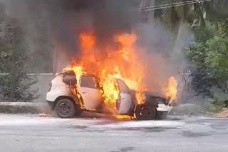 car-caught-fire-due-to-a-technical-fault-in-gauripur-service-road-at-srirangapatna
