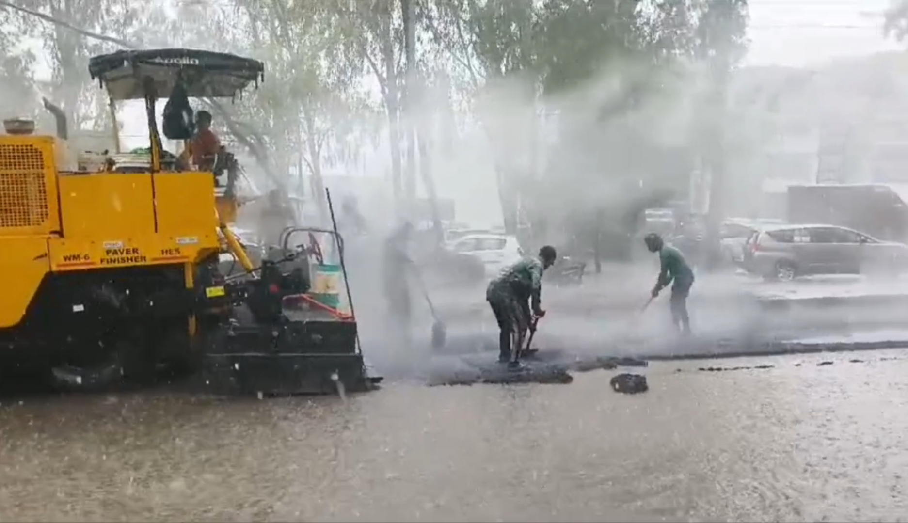 Video of construction of road worth crores of rupees amid heavy rains in Haryana Karnal goes viral Notice issued to officers and contractors