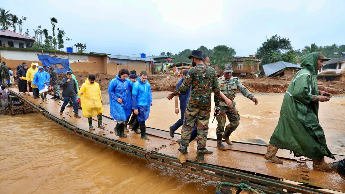 Lok Sabha and former Wayanad MP Rahul Gandhi along with party leader Priyanka Gandhi Vadra at the landslide site in Chooralmala, Wayanad.