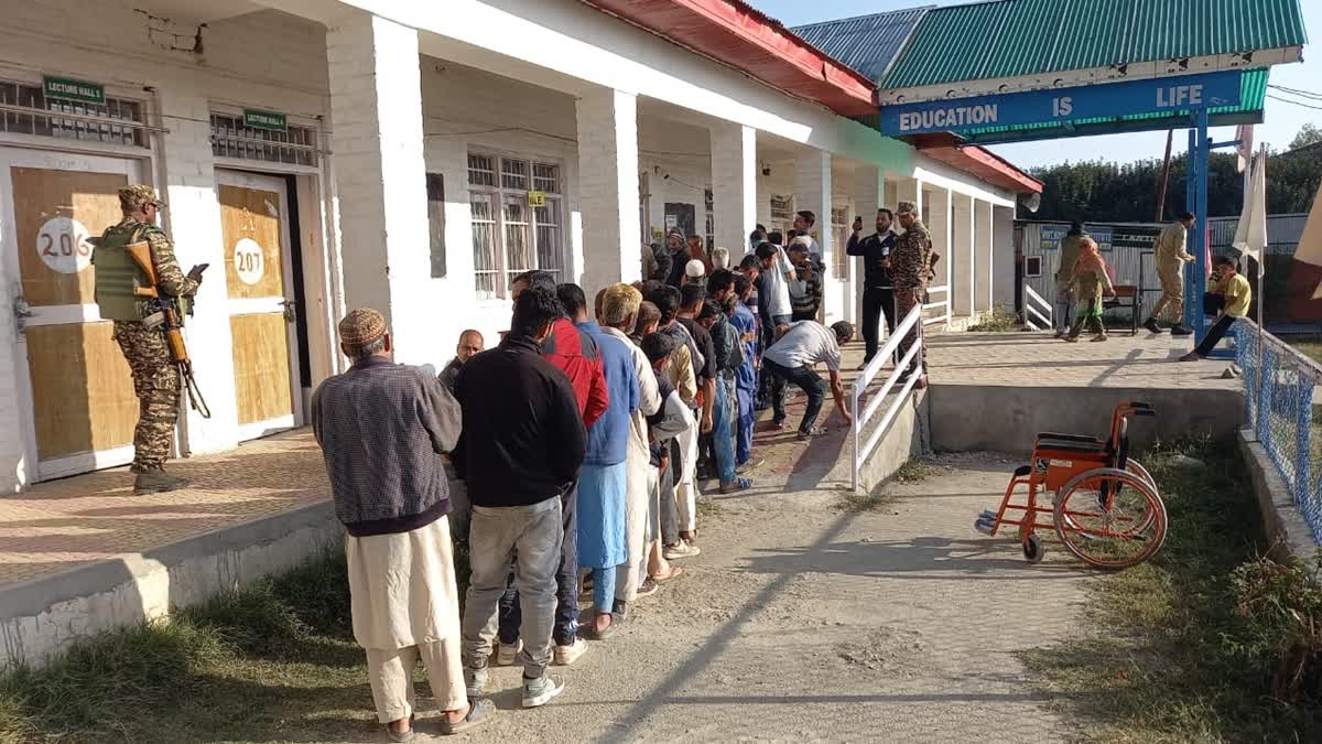 Voters queue up outside polling station to cast vote in the third phase of Jammu and Kashmir assembly election on Tuesday, October 1, 2024