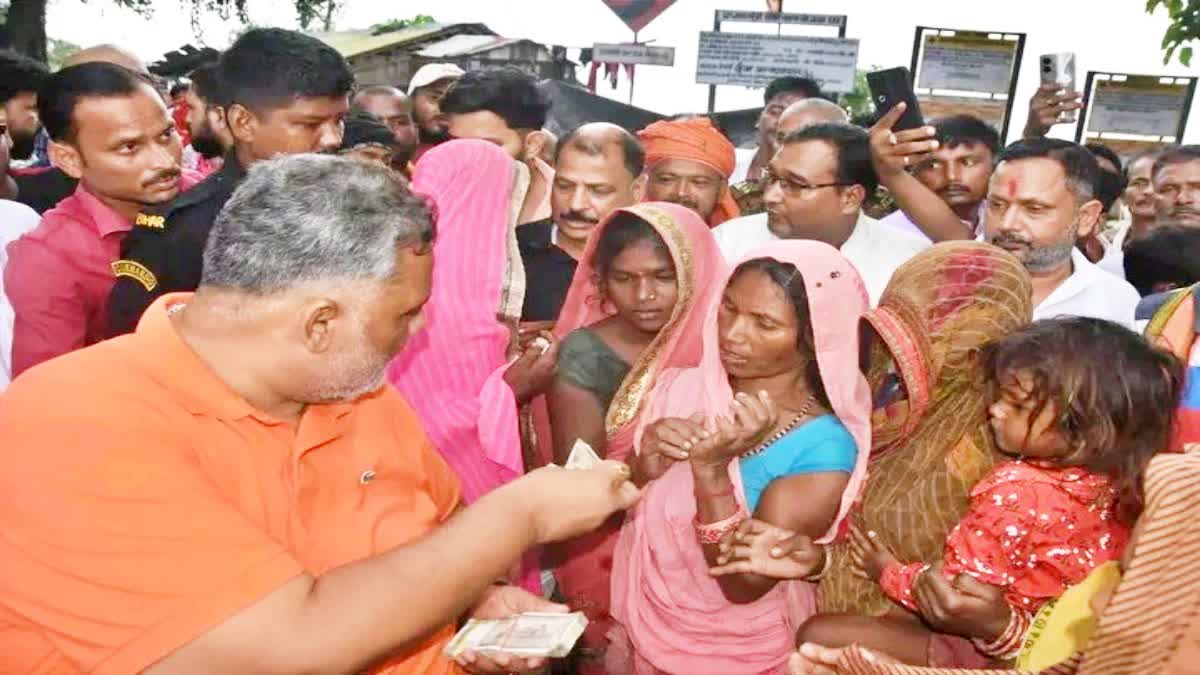 Pappu Yadav distributed money