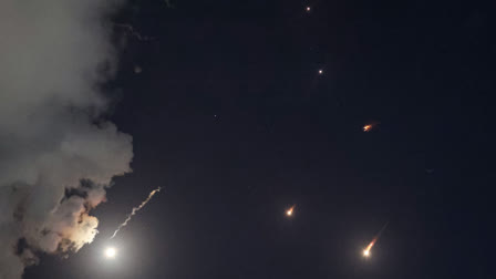 This picture shows projectiles being intercepted by Israel above Tel Aviv on October 1, 2024. Air raid sirens sounded in central Israel on October 1, the military said, a day after the army launched ground operations into southern Lebanon targeting Hezbollah positions. "Sirens sounded in central Israel," the military said, without providing details of the areas that were affected.