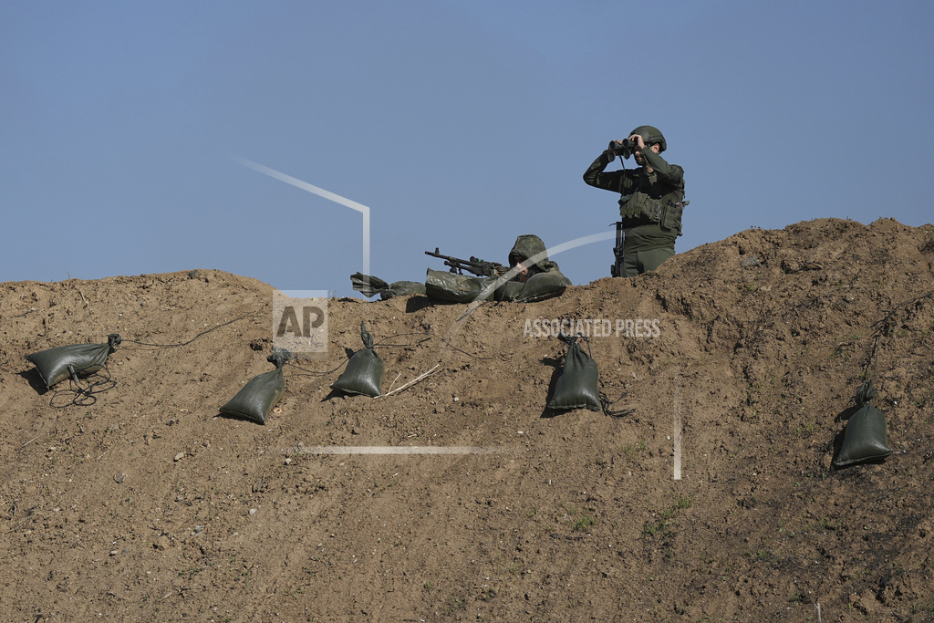 Israeli soldiers are seen near the border with the Gaza Strip, southern Israel