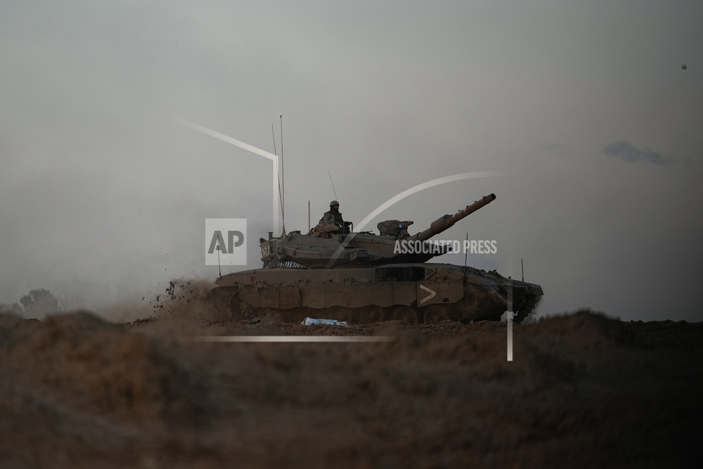 An Israeli army tank manoeuvers along Israel's border with the Gaza Strip