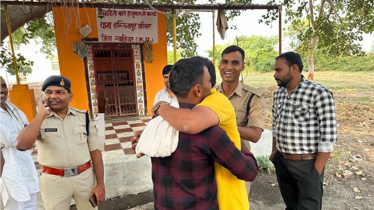 Two warring persons reconcile before Lord Hanuman at the 'Samjhauta Wale Hanuman Ji' temple in Hastinapur, Madhya Pradesh. The temple is becoming the centre of mediation and reconciliation