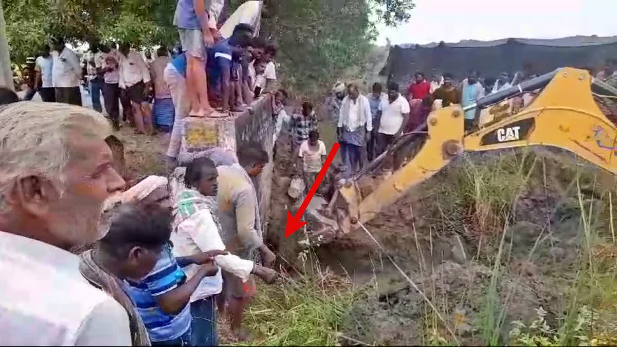 Fisherman stuck in a pond pipe