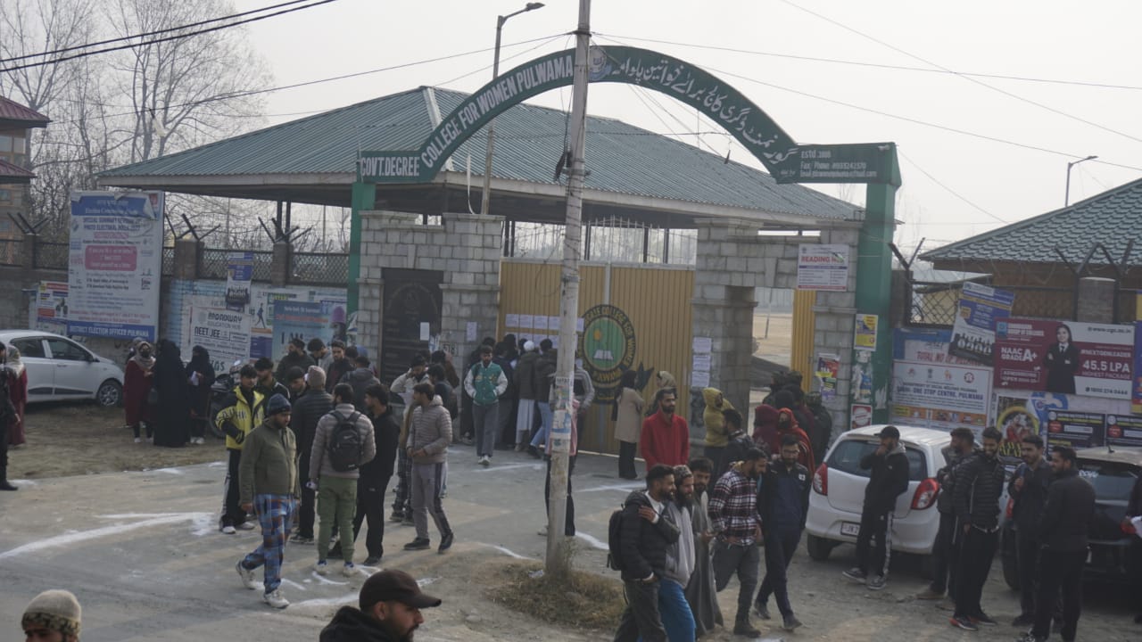 Candidates for police constable posts check their roll numbers outside an exam centre in Pulwama on Sunday, Dec 1, 2024. An estimated 5.6 lakh candidates applied for over 4000 posts