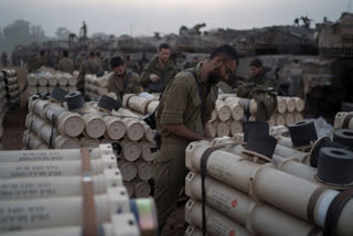 Israeli soldiers from the artillery unit store tank shells in a staging area at the Israeli-Gaza border in southern Israel, Monday, Jan. 1, 2024. The army is battling Palestinian militants across Gaza in the war ignited by Hamas' Oct. 7 attack into Israel. (AP Photo/Leo Correa)