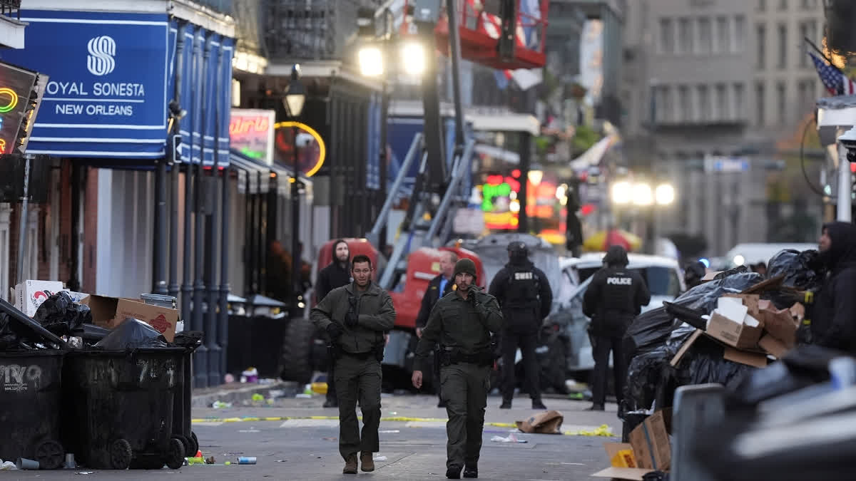 Emergency services attend the scene after a vehicle drove into a crowd on New Orleans' Canal and Bourbon Street, Wednesday Jan. 1, 2025.