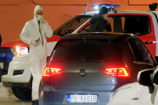 Police investigators work at the site of a shooting in Cetinje, 36 kilometers (22 miles) west of Podogrica, Montenegro, Wednesday, Jan 1, 2025.