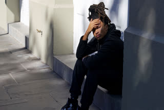 Trevant Hayes, 20, sits in the French Quarter after the death of his friend, Nikyra Dedeaux, 18, after a pickup truck crashed into pedestrians on Bourbon Street followed by a shooting in the French Quarter in New Orleans, Wednesday, Jan. 1, 2025.