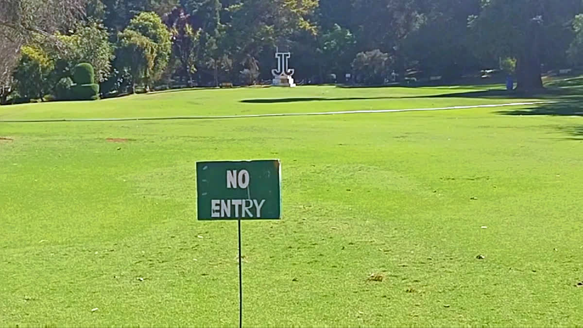 not allowed to walk inside the grassy grounds