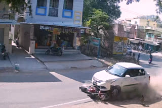 car crashing accident into a parked two wheeler in Pennagaram