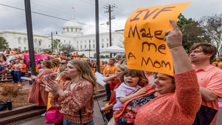 Veronica Wehby-Upchurch a sign and son Ladner Upchurch as hundreds gather for a protest rally for in vitro fertilization legislation Wednesday, Feb. 28, 2024, in Montgomery, Ala. The Alabama Supreme Court ruled, Friday, Feb. 16, 2024, that frozen embryos can be considered children under state law, a ruling critics said could have sweeping implications for fertility treatments. (Source AP)