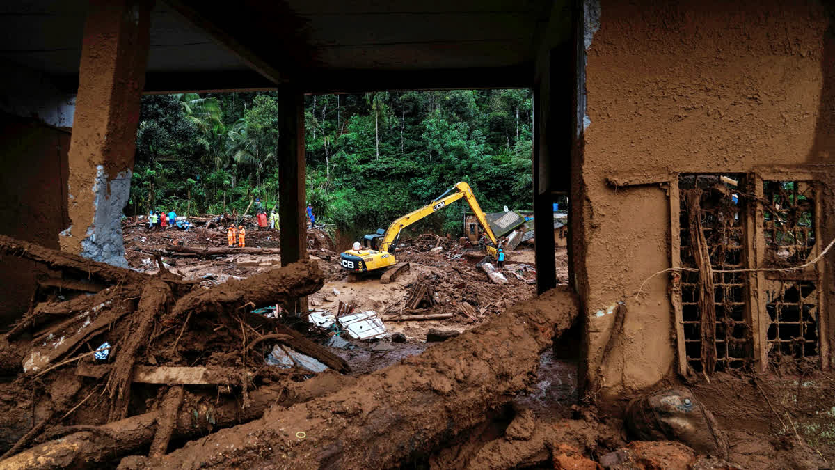 Rescuers search through mud and debris for a third day after landslides set off by torrential rains in Wayanad district of Kerala on Thursday.