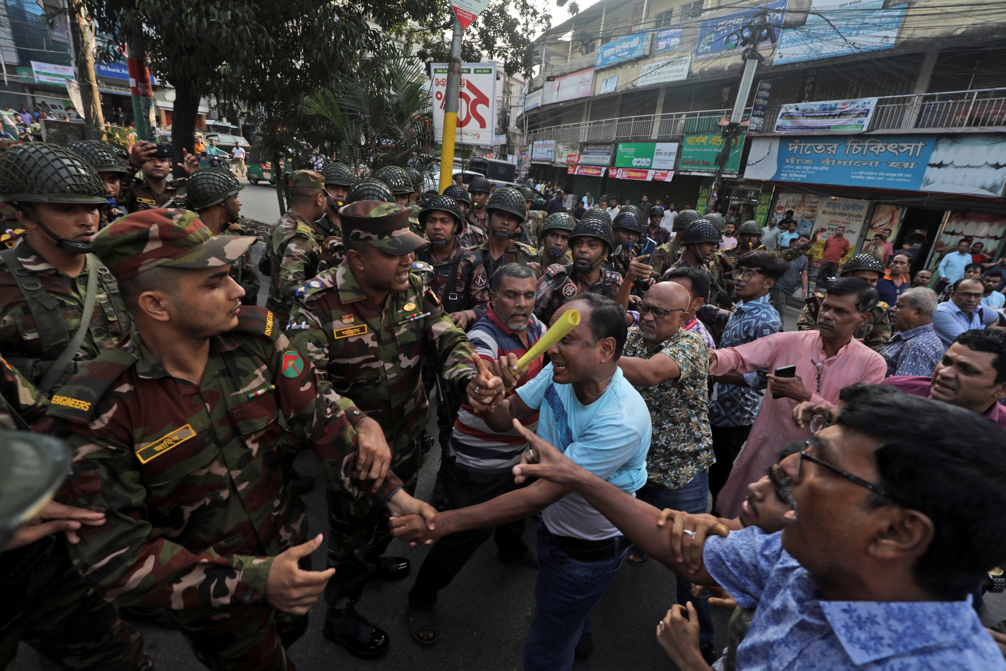 Bangladesh Hindus participating in a rally to demand that an interim government withdraw all cases against their leaders and protect them from attacks and harassment, argue with the security personnel in Chattogram, Bangladesh, Friday, Nov. 1, 2024.