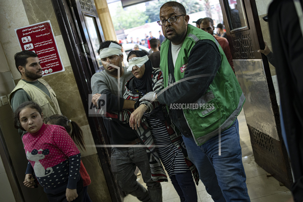 Palestinians wounded in Israeli bombardment of the Gaza Strip are brought to a hospital in Khan Younis