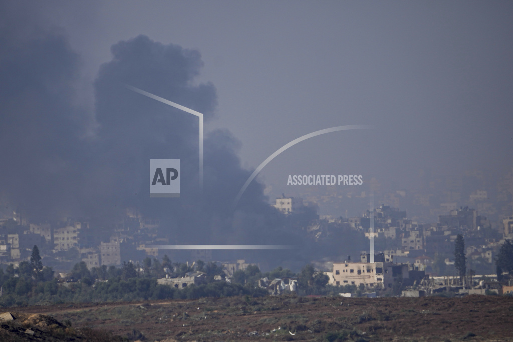 Smoke rises following an Israeli airstrike in the Gaza Strip, as seen from southern Israel, Friday, Dec. 1