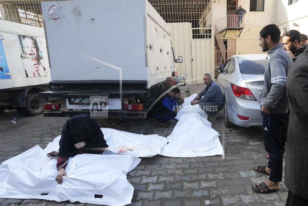 Palestinian mourn relatives were killed in the Israeli bombardment of the Gaza Strip