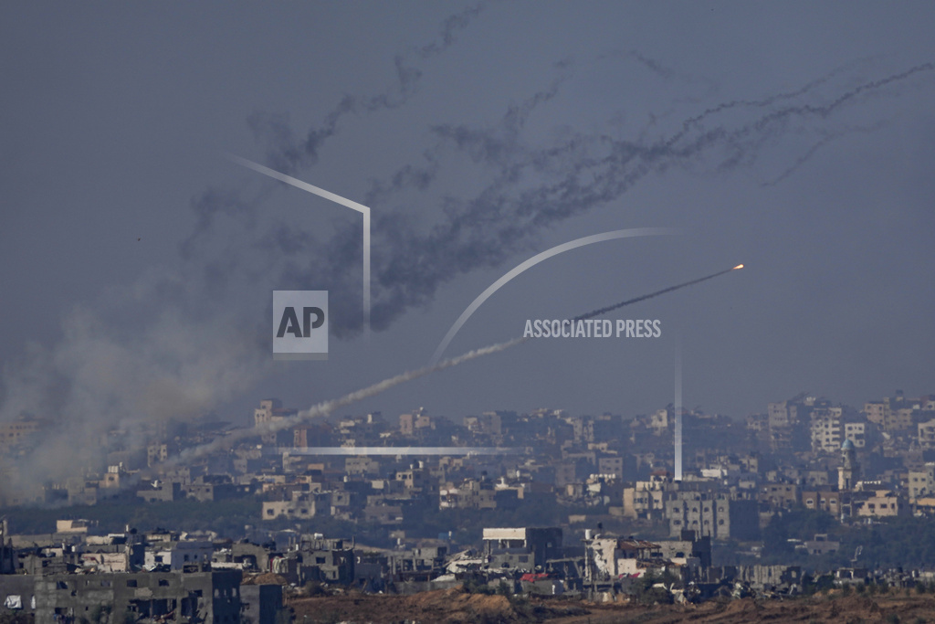 Rockets are fired toward Israel from the Gaza Strip, as seen from southern Israel