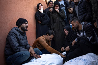 Palestinians mourn their relatives killed in the Israeli bombardment of the Gaza Strip, in the hospital in Khan Younis, Saturday, Dec. 2, 2023. (AP Photo/Fatima Shbair)