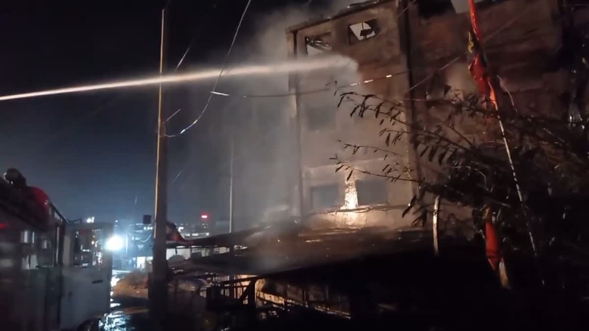 Firefighters extinguishing flames at a cosmetics factory in Himachal Pradesh's Solan