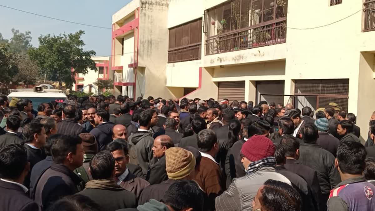 Lawyers gather outside apartment in Badaun where a woman judge was found dead