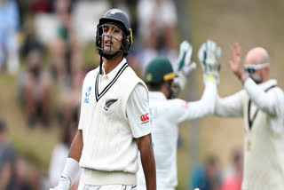 New Zealand Rachin Ravindra walks off after he is dismissed by Australia's Nathan Lyon on the fourth day of their cricket test match in Wellington, New Zealand, Sunday, March 3, 2024.