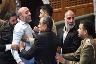 Awami Ittehad Party MLA Khurshid Ahmad Sheikh marshalled out of the Jammu & Kashmir Assembly