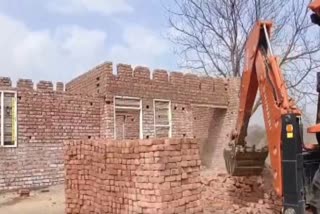 The house being demolished.