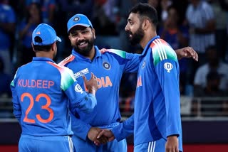 Kuldeep Yadav, Rohit Sharma and Varun Chakravarthy
