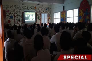 Students watch documentary short film