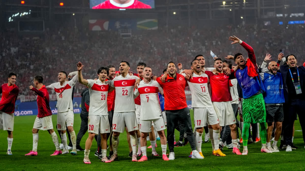 Turkey's players celebrate after a round of sixteen match against Austria at the Euro 2024 soccer tournament in Leipzig, Germany, Tuesday, July 2, 2024.